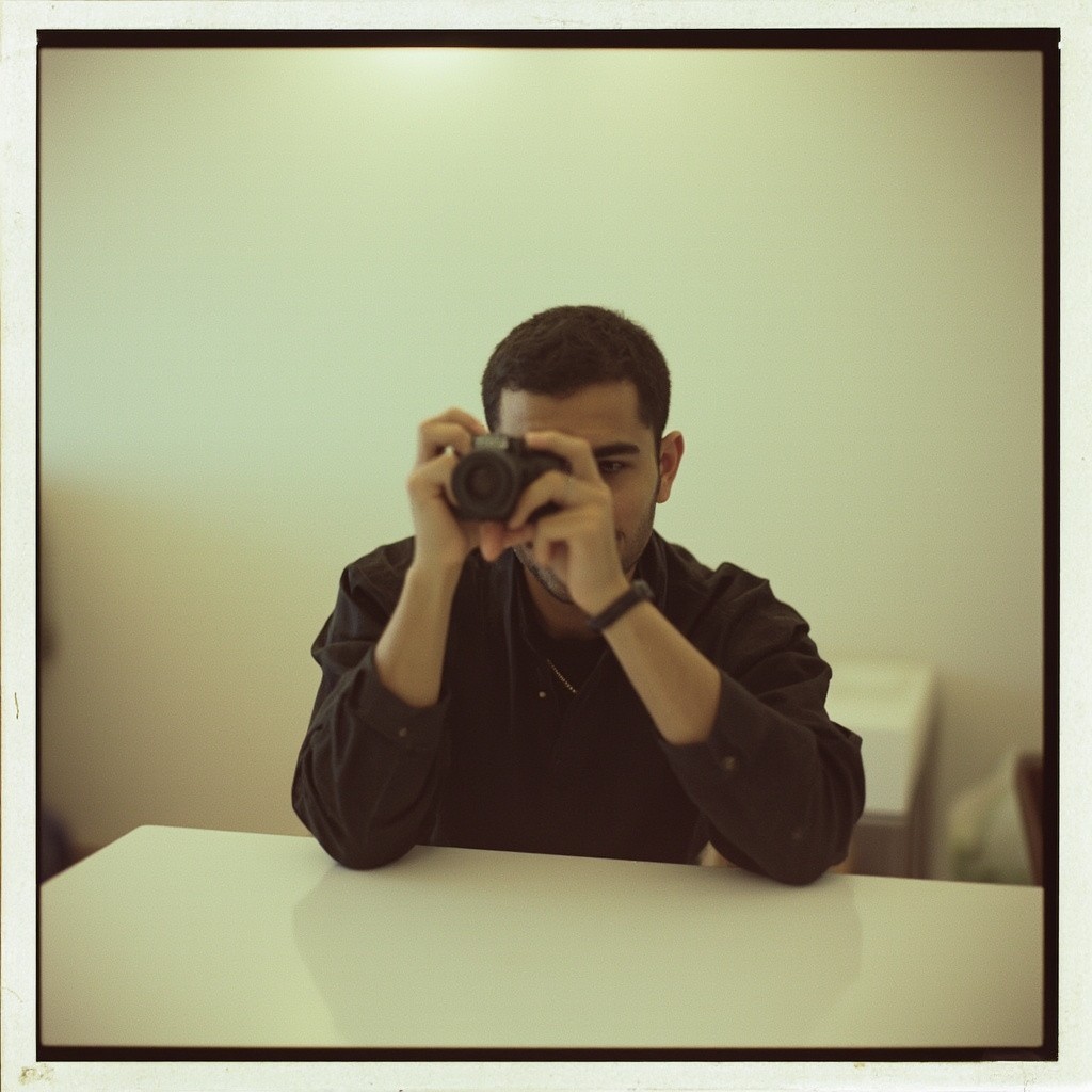 A Person Capturing a Photo with Polaroid Camera